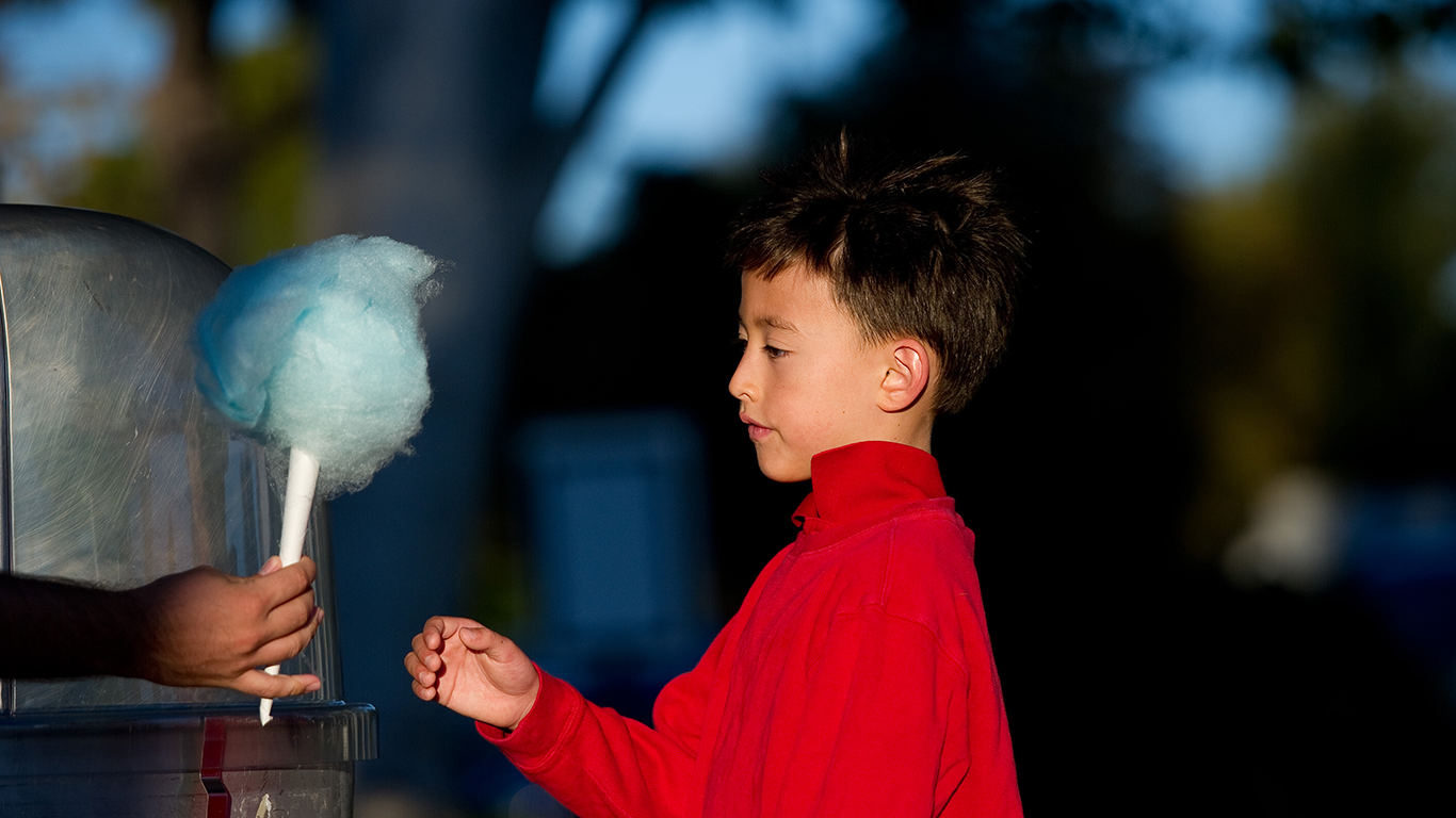 A kid receiving cotton candy