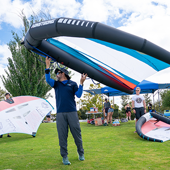 Demonstrating the wing of a wingfoil.