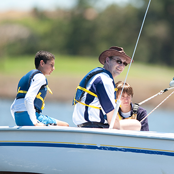 Two boys and an instructor sailing